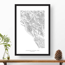 Load image into Gallery viewer, National park print of Glacier Bay with black and white topography in a black 24x36 vertical frame.