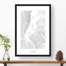 Load image into Gallery viewer, Topography map print print of Jackson Hole, Wyoming with black and white topography in a black 24x36 vertical frame.