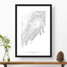 Load image into Gallery viewer, Kenai Fjords National Park topographic map poster, 24 inches by 36 inches, in a vertical orientation, with a black solid wood ready-to-hang frame.