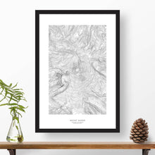 Load image into Gallery viewer, Mountain art print of Mount Baker with black and white topography in a black 24x36 vertical frame.