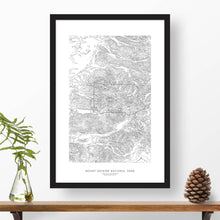 Load image into Gallery viewer, Mount Rainier National Park topographic map poster, 24 inches by 36 inches, in a vertical orientation, with a black solid wood ready-to-hang frame.