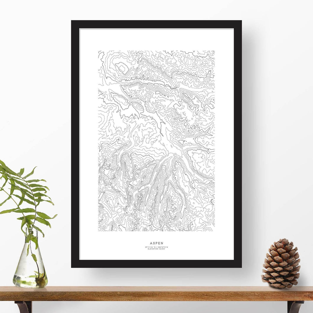Black and white map and travel art of the Aspen, Colorado ski area. Topography contours are in black on a white background. Text below the image can be personalized for a perfect custom map art gift idea.