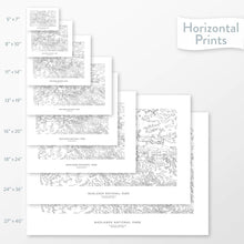 Load image into Gallery viewer, Available sizes for Badlands National Park topographic maps. 5x7, 8x10, 11x14, 16x20, 18x24, 24x36, and 27x40 posters shown. as black and white prints on a gray background.
