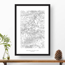 Load image into Gallery viewer, National park print of Badlands National Park with black and white topography in a black 24x36 vertical frame.
