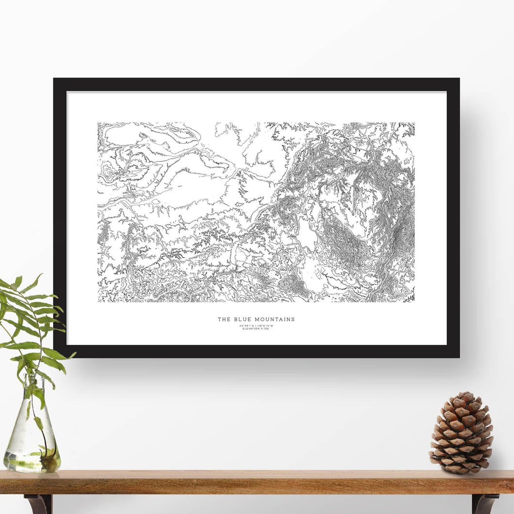 Blue Mountains (the Blues) in Washington and Oregon, featured in a topographic map poster, 24 inches by 36 inches, in a vertical orientation, with a black solid wood ready-to-hang frame.