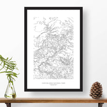 Load image into Gallery viewer, Canyonlands National Park topographic map poster, 24 inches by 36 inches, in a vertical orientation, with a black solid wood ready-to-hang frame.
