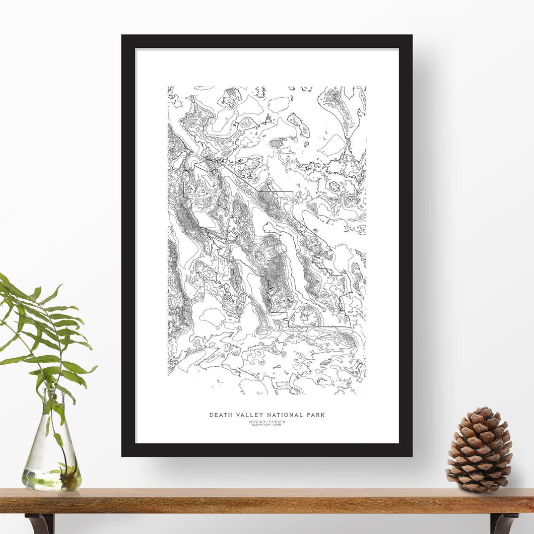 Death Valley National Park topographic map poster, 24 inches by 36 inches, in a vertical orientation, with a black solid wood ready-to-hang frame.