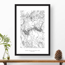 Load image into Gallery viewer, Grand Canyon National Park topographic map poster, 24 inches by 36 inches, in a vertical orientation, with a black solid wood ready-to-hang frame.
