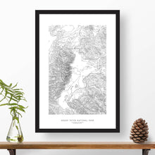 Load image into Gallery viewer, Grand Teton National Park topographic map poster, 24 inches by 36 inches, in a vertical orientation, with a black solid wood ready-to-hang frame.
