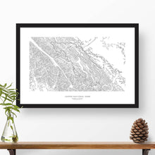 Load image into Gallery viewer, Map wall decor in a black frame. Contour lines of Jasper National Park are drawn on a white background. Text  below the map can be customized to create custom adventure art.
