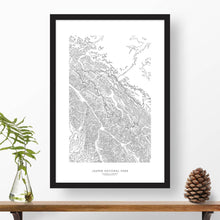 Load image into Gallery viewer, Jasper National Park topographic map poster, 24 inches by 36 inches, in a vertical orientation, with a black solid wood ready-to-hang frame.

