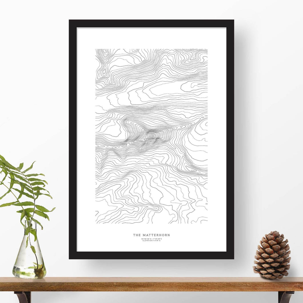 Print of the Matterhorn, Switzerland with black and white topography in a black 24x36 vertical frame.