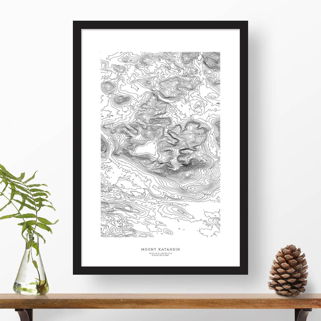 Black and white map and travel art of Mount Katahdin, Maine. Topography contours are in black on a white background. Text below the image can be personalized for a perfect custom map art gift idea.