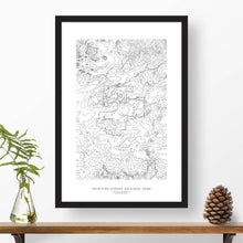 Load image into Gallery viewer, National park print of Petrified Forest with black and white topography in a black 24x36 vertical frame.
