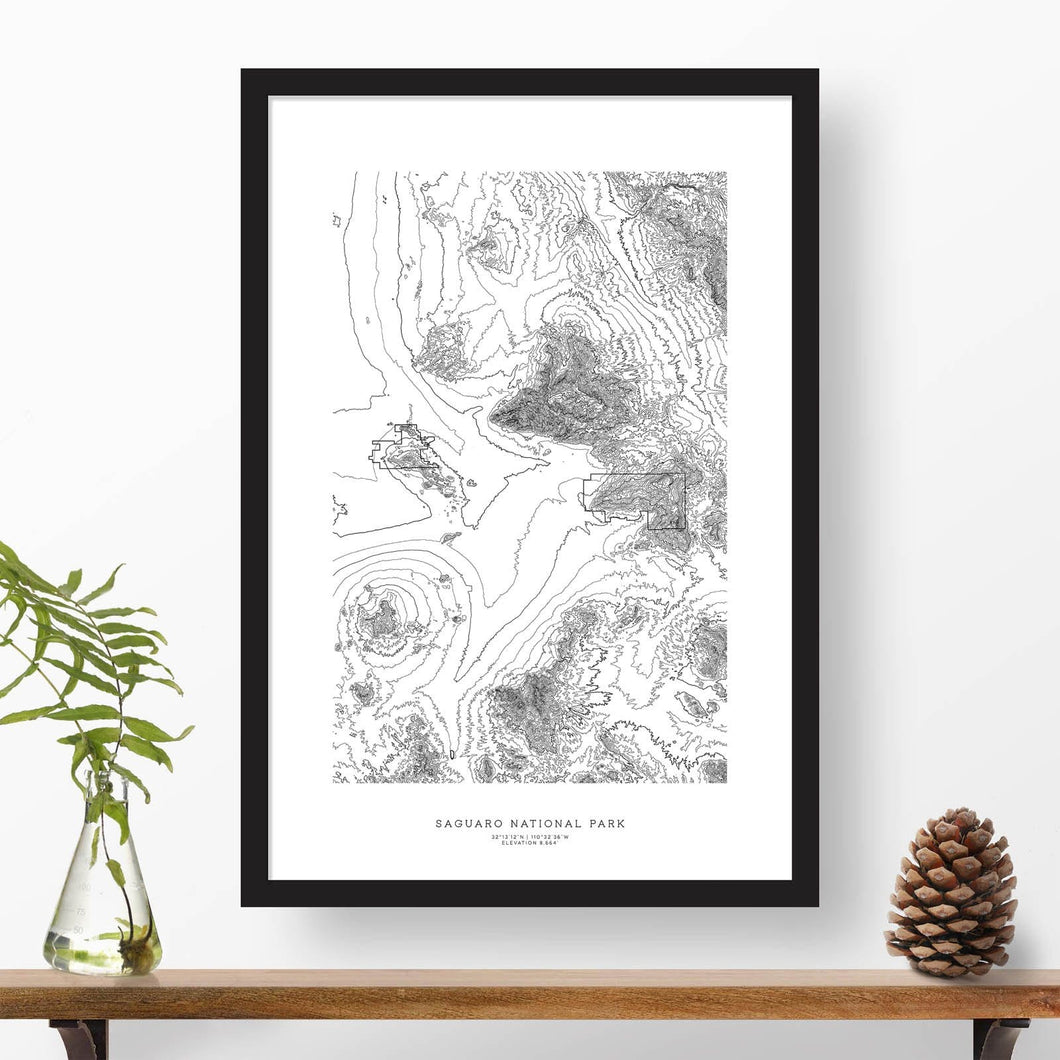 Black and white map and travel art of Saguaro National Park. Topography contours are in black on a white background. Text below the image can be personalized for a perfect custom map art gift idea.