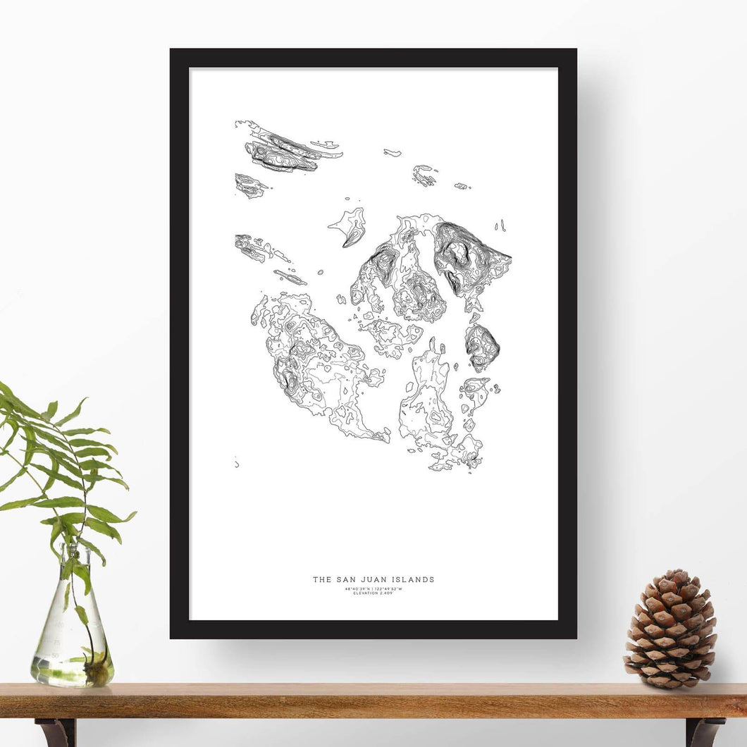 Black and white map and travel art of the San Juan Islands. Topography contours are in black on a white background. Text below the image can be personalized for a perfect custom map art gift idea.