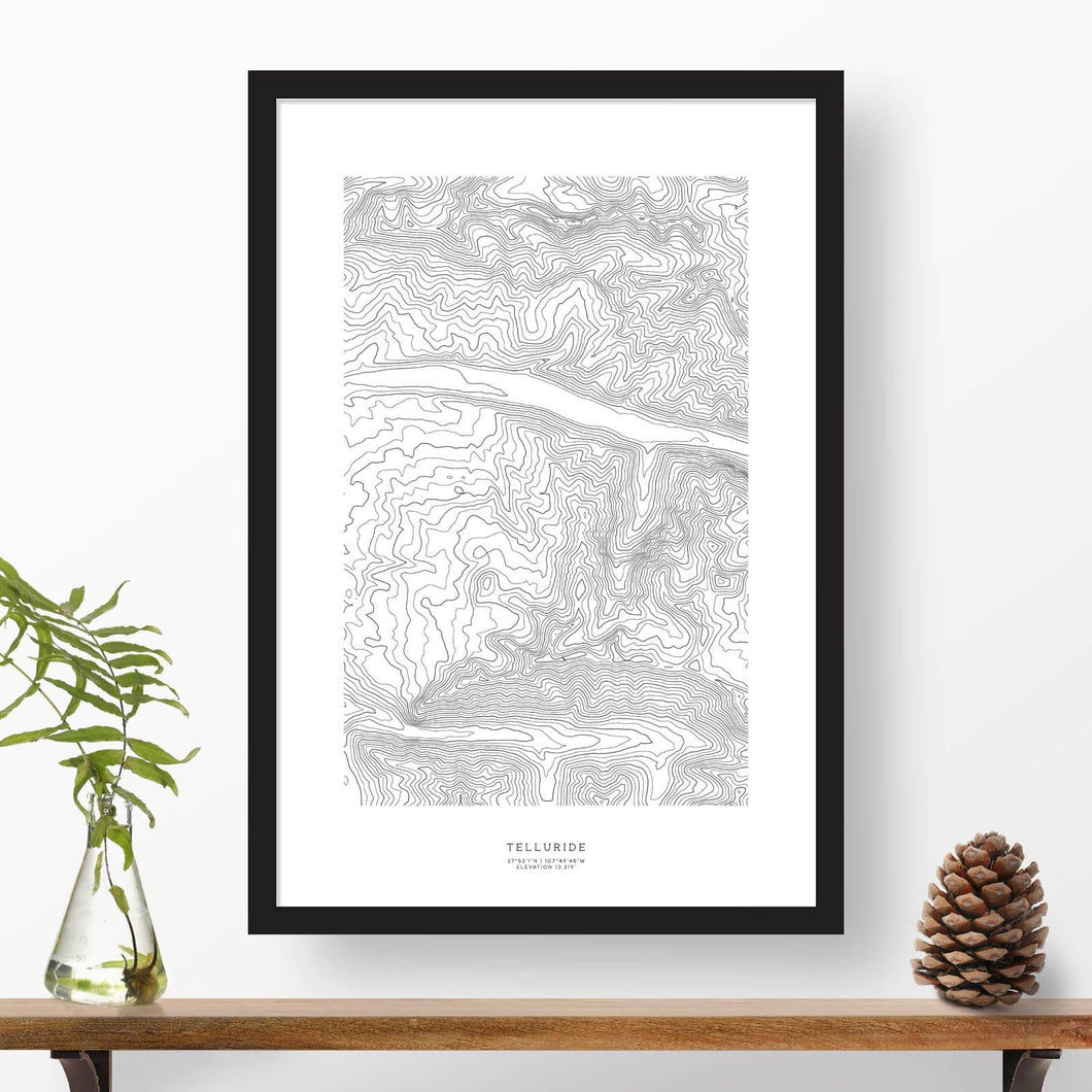 Black and white map and travel art of Telluride Ski Resort. Topography contours are in black on a white background. Text below the image can be personalized for a perfect custom map art gift idea.