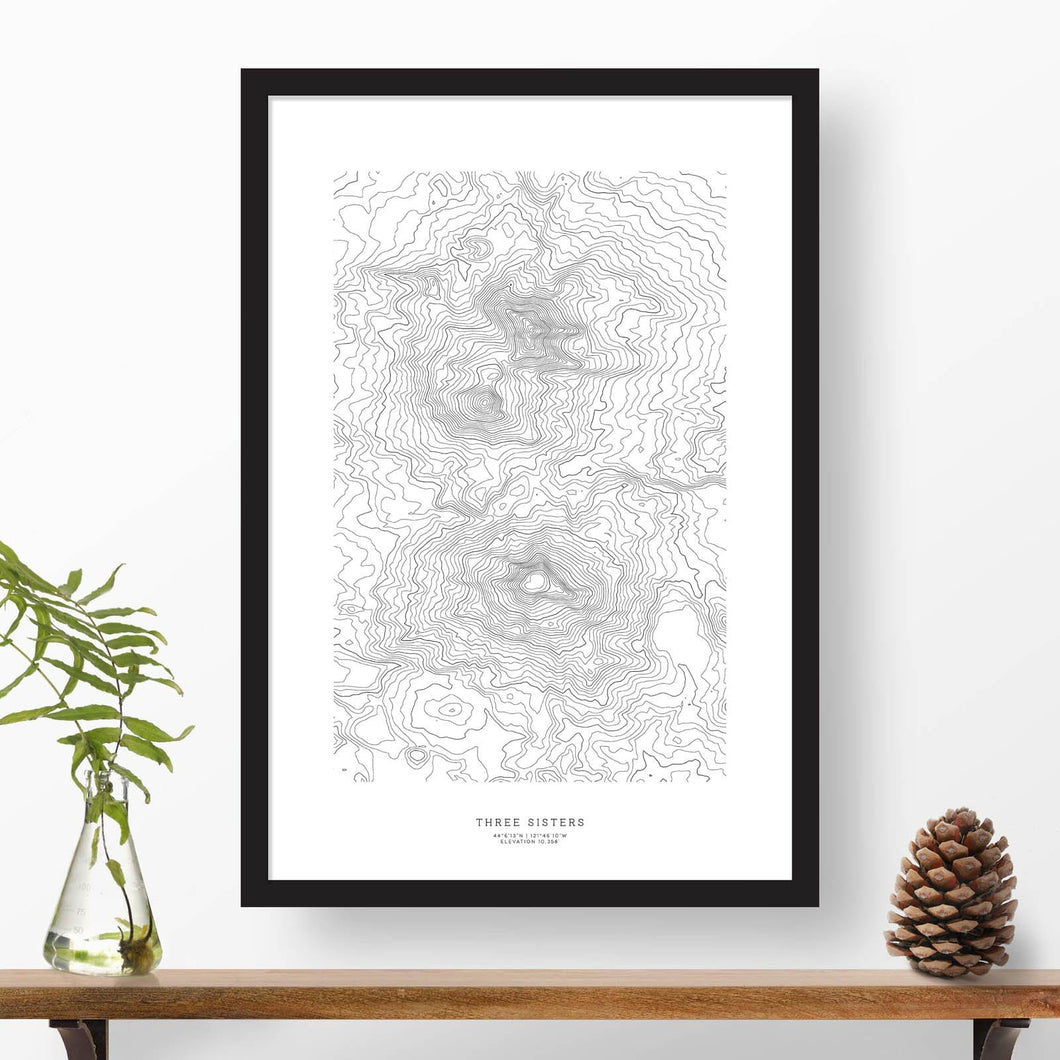 Three Sisters, Oregon topographic map poster, 24 inches by 36 inches, in a vertical orientation, with a black solid wood ready-to-hang frame.