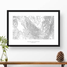 Load image into Gallery viewer, Map wall decor in a black frame. Contour lines of the Wallowa Mountains in Oregon are drawn on a white background. Text  below the map can be customized to create custom adventure art.
