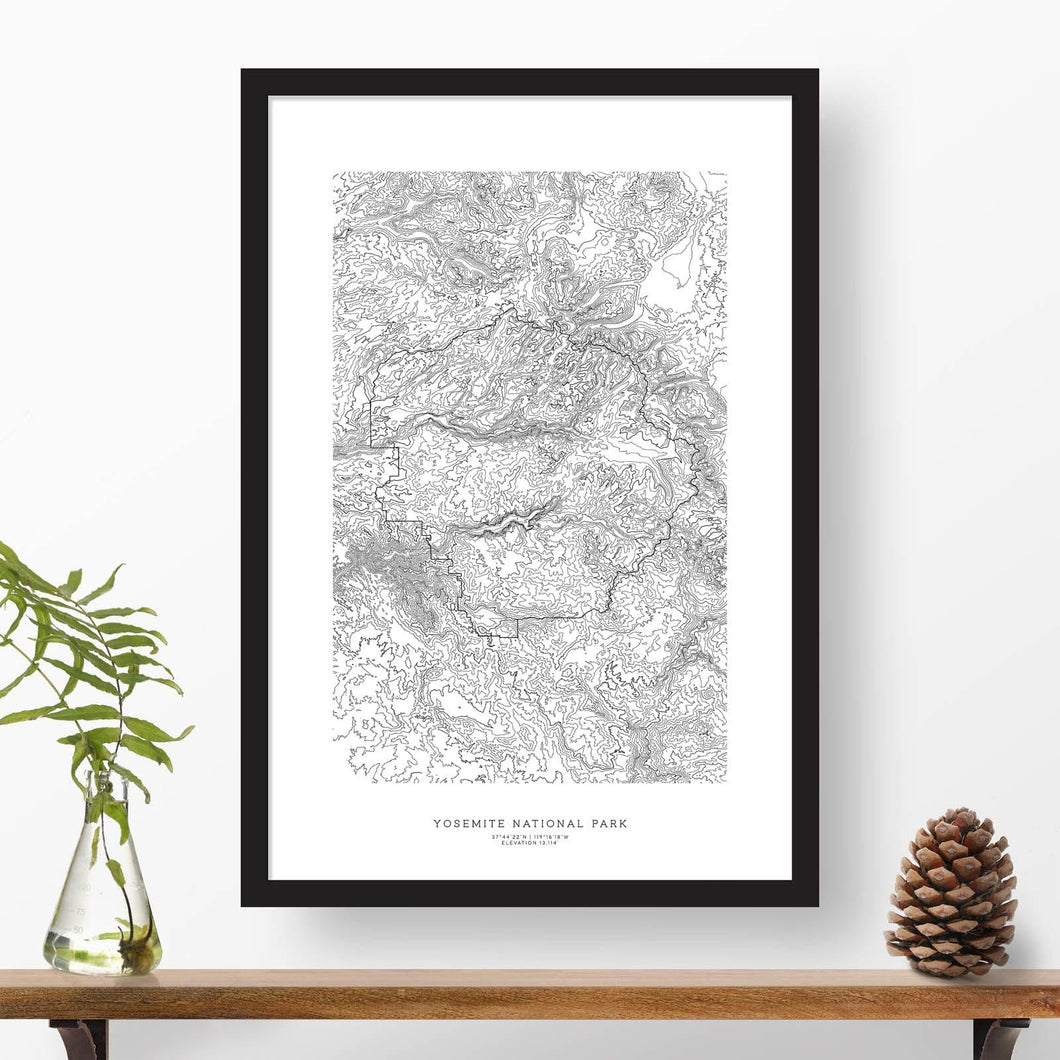 National park print of Yosemite with black and white topography in a black 24x36 vertical frame.
